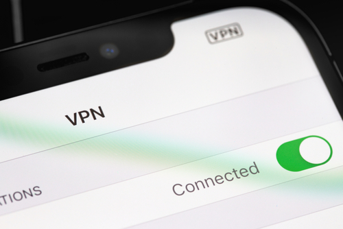 Apple iPhone with VPN Settings on screen