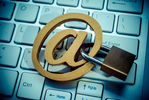 Email sign with a padlock on computer keyboard Email encryption concept