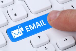Sending encrypted E-Mail email protection secure mail via internet on computer with letter symbol