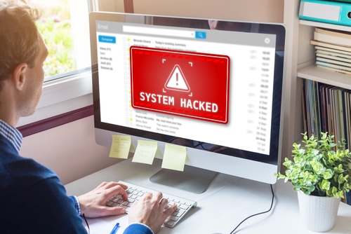 System hacked alert on computer screen after cyber attack on network Cybersecurity vulnerability on internet, virus, data breach, malicious connection