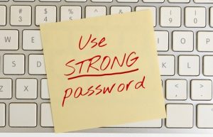 The concept of information security The inscription use a strong password on a note on the pc keyboard